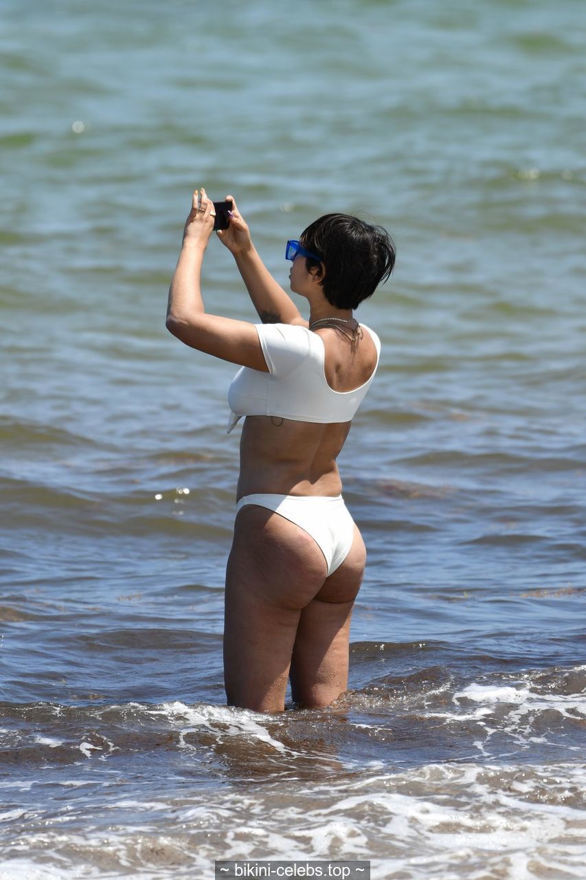Jackie Cruz cleavage in white bikini on the beach in Miami.